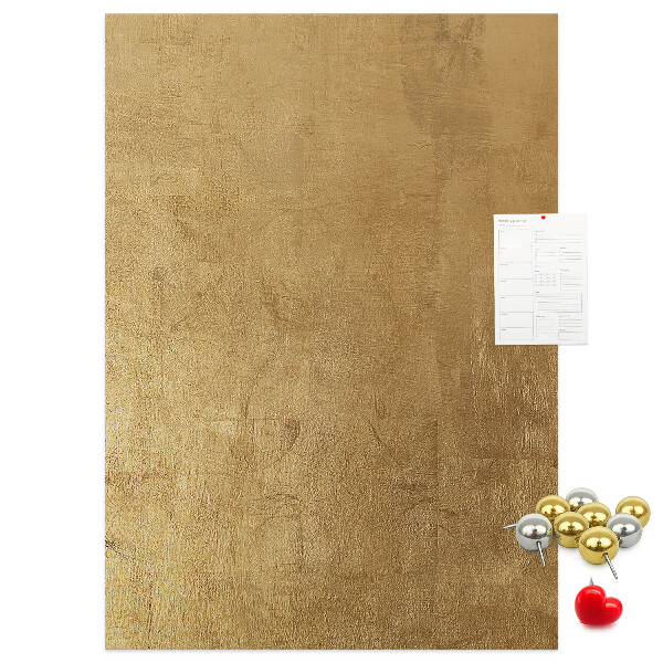 Kork-Pinnwand mit Goldpapier und farbigen Stecknadeln