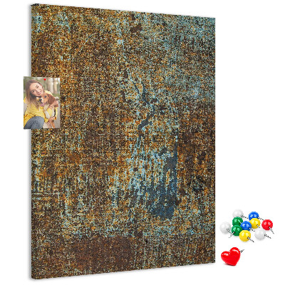 Pinnwand mit rustikaler Textur und blauen Akzenten