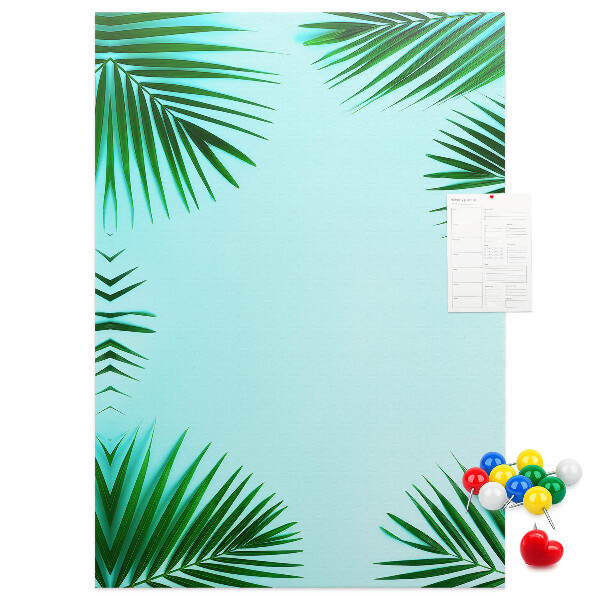 Korkpinnwand mit Palmenblätter-Motiv auf blauem Hintergrund