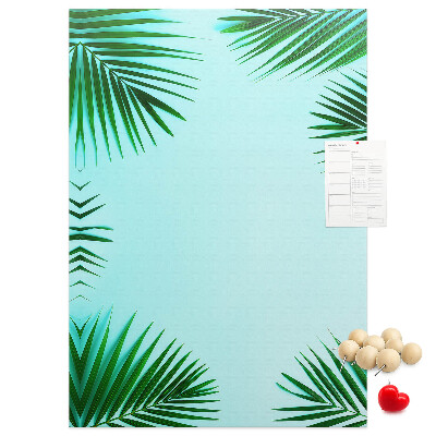 Korkpinnwand mit Palmenblätter-Motiv auf blauem Hintergrund