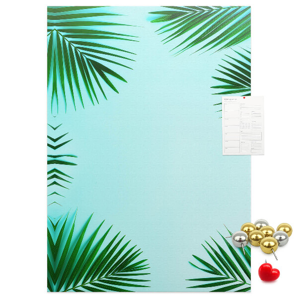 Korkpinnwand mit Palmenblätter-Motiv auf blauem Hintergrund