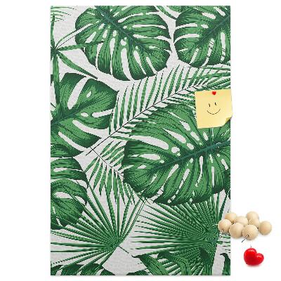 Bedruckte Korkplatte mit Monstera-Blättern auf hellem Hintergrund
