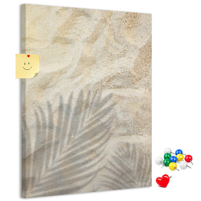 Pinnwand Wüstensand mit dem zarten Schatten eines Blattes