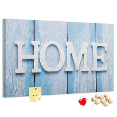 Korktafel mit stilvollem HOME-Schriftzug auf blauem Hintergrund