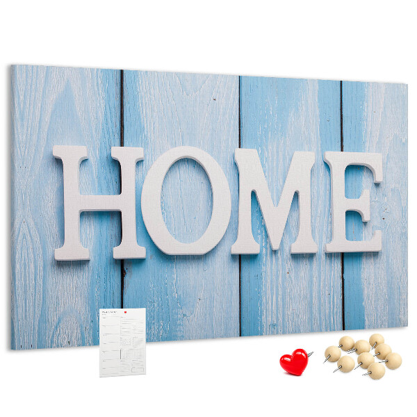 Korktafel mit stilvollem HOME-Schriftzug auf blauem Hintergrund