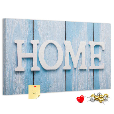 Korktafel mit stilvollem HOME-Schriftzug auf blauem Hintergrund