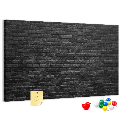 Bild mit Korkrückwand Nahaufnahme einer dunklen strukturierten Backsteinwand
