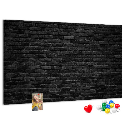 Bild mit Korkrückwand Nahaufnahme einer dunklen strukturierten Backsteinwand