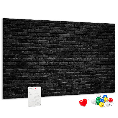 Bild mit Korkrückwand Nahaufnahme einer dunklen strukturierten Backsteinwand