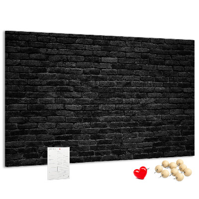 Bild mit Korkrückwand Nahaufnahme einer dunklen strukturierten Backsteinwand