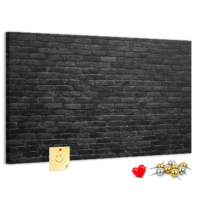 Bild mit Korkrückwand Nahaufnahme einer dunklen strukturierten Backsteinwand