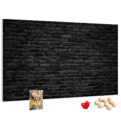 Bild mit Korkrückwand Nahaufnahme einer dunklen strukturierten Backsteinwand
