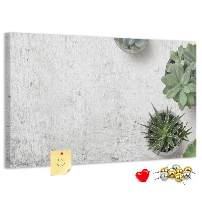 Korktafel mit Motiv Topfpflanzen auf grauem Hintergrund