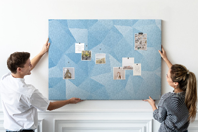 Korkbild mit geometrischen blauen Dreiecken in verschiedenen Schattierungen
