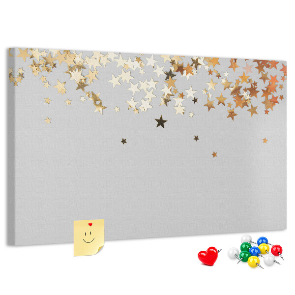 Korkbild mit goldenen Sternen auf grauem Hintergrund