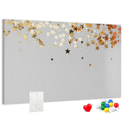 Korkbild mit goldenen Sternen auf grauem Hintergrund