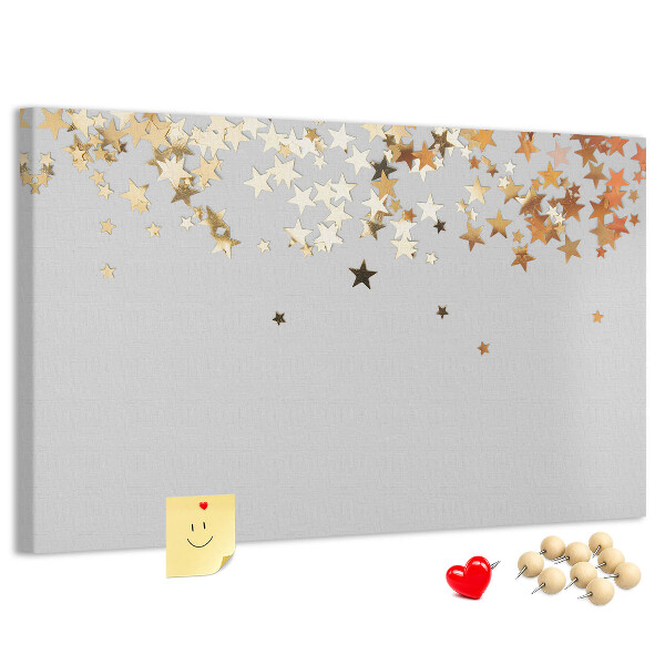 Korkbild mit goldenen Sternen auf grauem Hintergrund