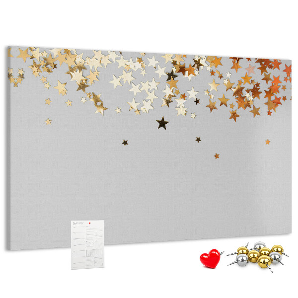 Korkbild mit goldenen Sternen auf grauem Hintergrund