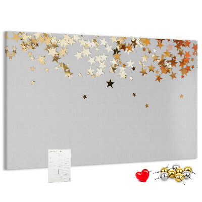 Korkbild mit goldenen Sternen auf grauem Hintergrund