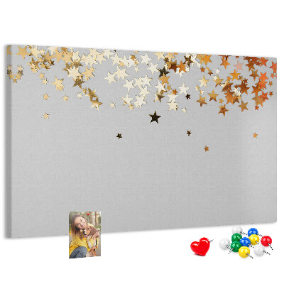 Korkbild mit goldenen Sternen auf grauem Hintergrund