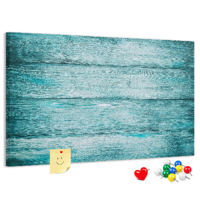 Korktafel mit grünem und blauem Holzbrett-Hintergrund