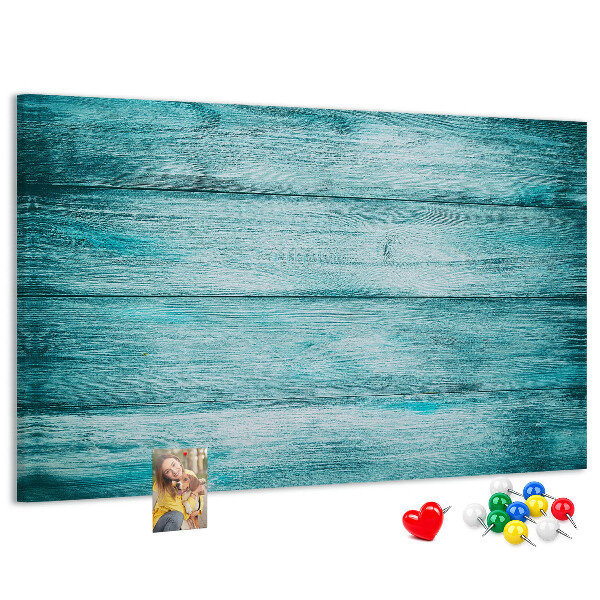 Korktafel mit grünem und blauem Holzbrett-Hintergrund