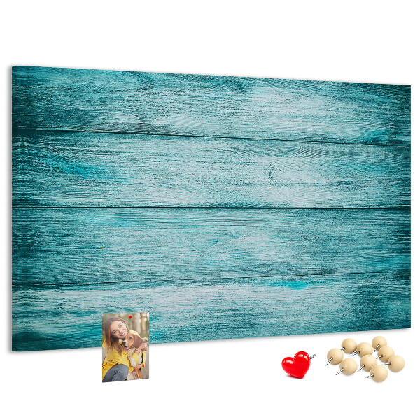 Korktafel mit grünem und blauem Holzbrett-Hintergrund