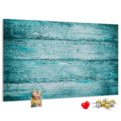 Korktafel mit grünem und blauem Holzbrett-Hintergrund