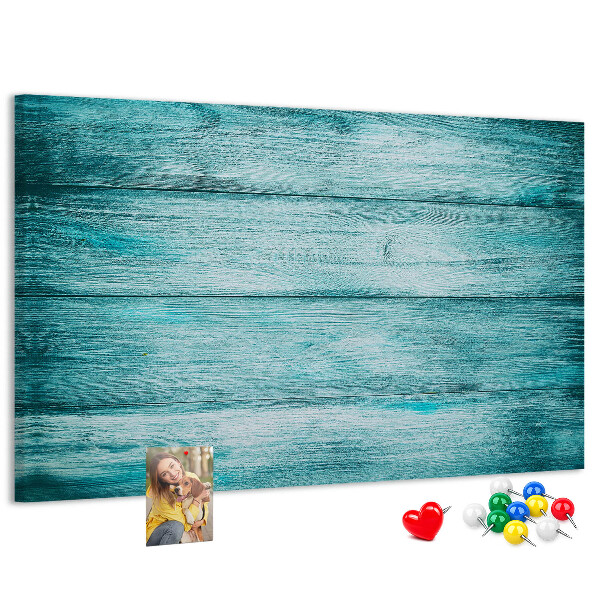 Korktafel mit grünem und blauem Holzbrett-Hintergrund