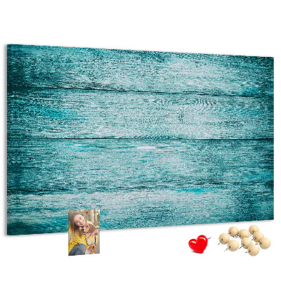 Korktafel mit grünem und blauem Holzbrett-Hintergrund