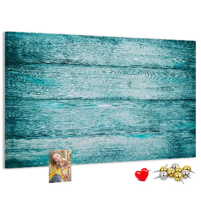 Korktafel mit grünem und blauem Holzbrett-Hintergrund