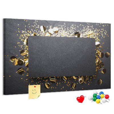 Korkbild goldenes Konfetti auf schwarzem Hintergrund