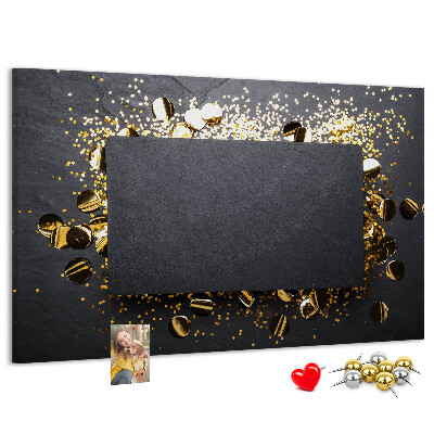 Korkbild goldenes Konfetti auf schwarzem Hintergrund