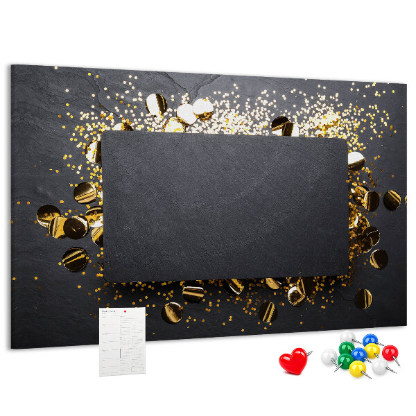 Korkbild goldenes Konfetti auf schwarzem Hintergrund