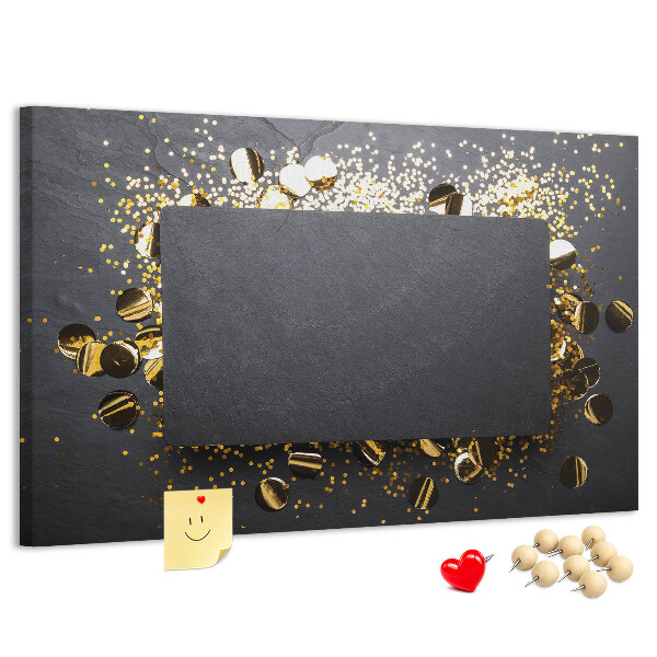 Korkbild goldenes Konfetti auf schwarzem Hintergrund