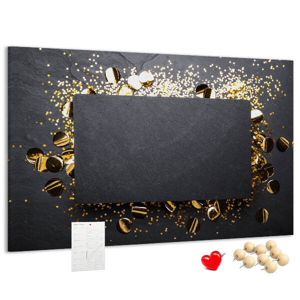 Korkbild goldenes Konfetti auf schwarzem Hintergrund