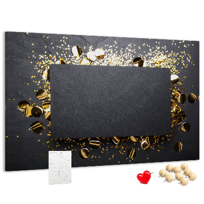Korkbild goldenes Konfetti auf schwarzem Hintergrund