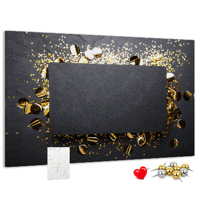 Korkbild goldenes Konfetti auf schwarzem Hintergrund
