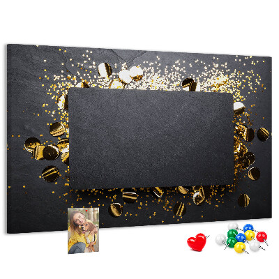 Korkbild goldenes Konfetti auf schwarzem Hintergrund