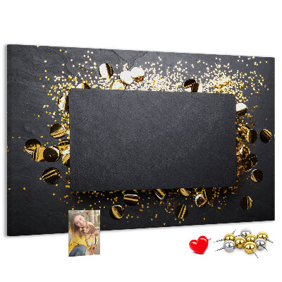 Korkbild goldenes Konfetti auf schwarzem Hintergrund