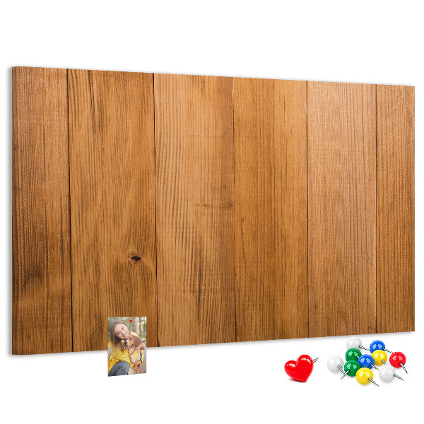 Korkbild mit farbigen Stecknadeln auf Holzbrett