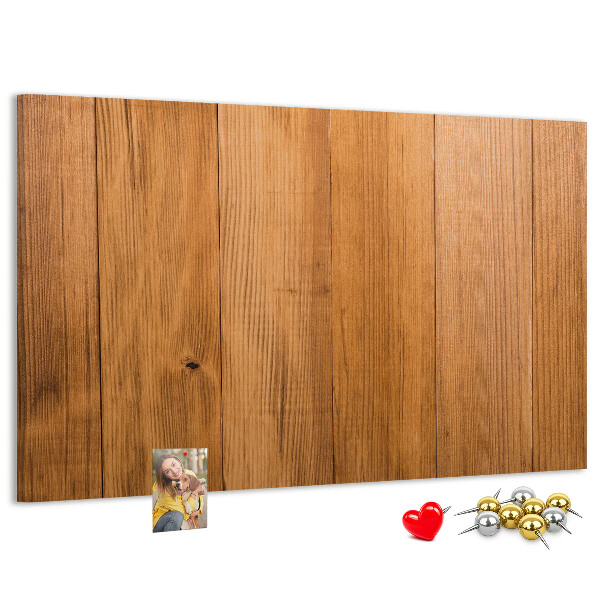 Korkbild mit farbigen Stecknadeln auf Holzbrett