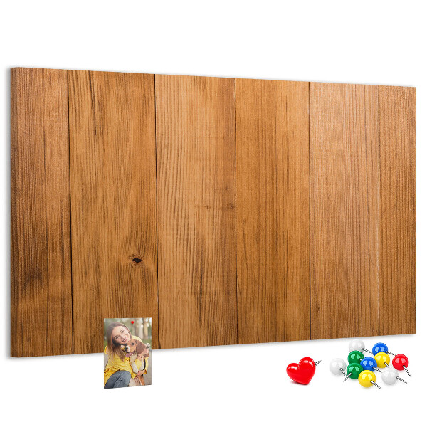 Korkbild mit farbigen Stecknadeln auf Holzbrett
