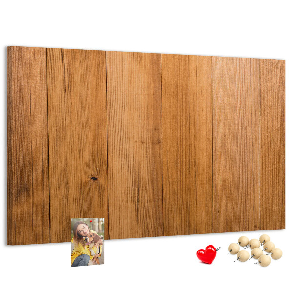 Korkbild mit farbigen Stecknadeln auf Holzbrett