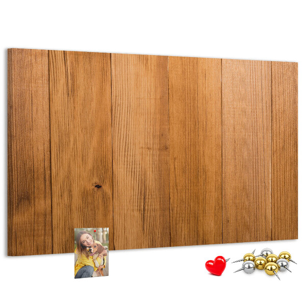 Korkbild mit farbigen Stecknadeln auf Holzbrett