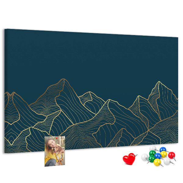 Kork-Pinnwand mit goldenen Bergumrissen auf dunklem Hintergrund