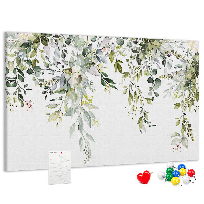 Korktafel mit Motiv aus grünen Blättern und zarten Blüten