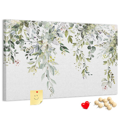 Korktafel mit Motiv aus grünen Blättern und zarten Blüten