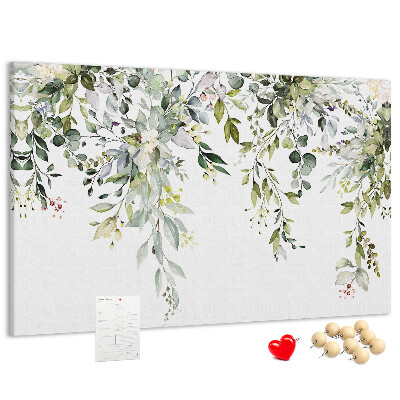 Korktafel mit Motiv aus grünen Blättern und zarten Blüten