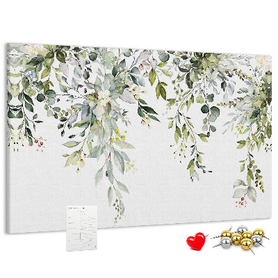 Korktafel mit Motiv aus grünen Blättern und zarten Blüten